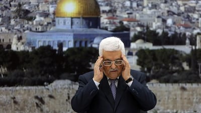 Palestinian president Mahmoud Abbas recites a prayer in memory of those killed during the Israeli military offensive on the Gaza Strip, ahead of an announcement that a truce had been reached on August 26, 2014. Abbas Momani/AFP Photo
