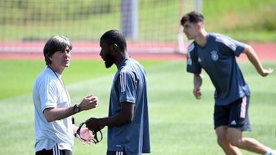 Germany coach Joachim Low speaks to defender Antonio Ruediger ahead of the clash with Portugal. AFP