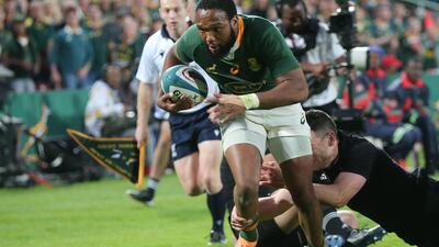 South Africa centre Lukhanyo Am breaks free to score their opening try. AFP
