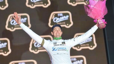 Australian rider Luke Durbridge of the Orica GreenEdge team wears the White jersey as he celebrates on the podium after his team won the first stage of the 2014 Giro d'Italia in Belfast on Friday. Luca Zennaro / EPA