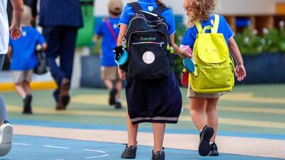 Pupils heading to school for the first day after the summer break at the Pearl Academy School on Muroor Road. Abu Dhabi. Victor Besa / The National