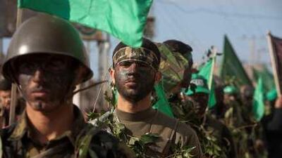 Hamas militants march during a demonstration at the Nusseirat refugee camp in Gaza City this month