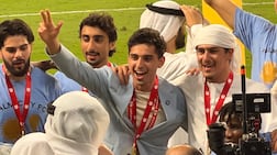 Palm City owner Soheil Var Var and Sheikh Ahmed celebrate with their players following the UAE FA Cup final victory over Hatta. Mina Rzouki / The National