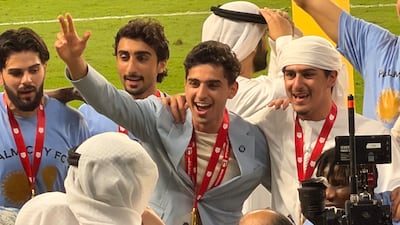 Palm City owner Soheil Var Var and Sheik Ahmed celebrate with their players following their UAE FA Cup final victory over Hatta. Mina Rzouki / The National
