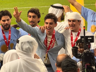 Palm City owner Soheil Var Var and Sheik Ahmed celebrate with their players following their UAE FA Cup final victory over Hatta. Mina Rzouki / The National