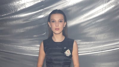 Millie Bobby Brown, wearing a Moncler Genius gown, attends the brand's Milan Fashion Week show on February 20, 2018. Getty Images