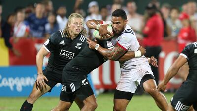 Martin Iosefo of the US, in white, in action with Nicole. Reuters