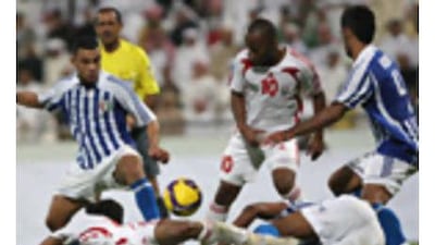 Ismail Matar, centre standing, of the UAE in action against Kuwait at Al Wasl Stadium on Tuesday.