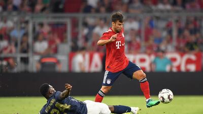 Manchester United's Tim Fosu-Mensah challenges Bayern Munich's Juan Bernat. Getty Images