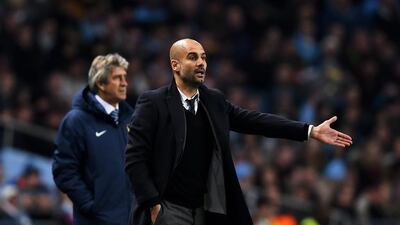 Outgoing Bayern Munich coach Pep Guardiola, right, will take over from Manuel Pellegrini, left, at Manchester City on a three-year deal from the end of the season, the English club announced Monday. (Photo by Laurence Griffiths/Bongarts/Getty Images)