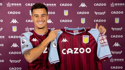 New loan signing Philippe Coutinho poses with an Aston Villa shirt. Getty