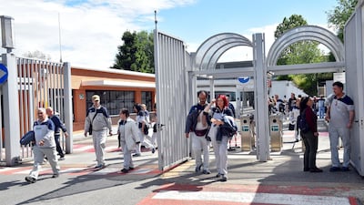 Fiat Chrysler workers exit the Mirafiori plant in Turin, where the workforce was banking on the Maserati Levante's popularity to boost working hours. Reuters