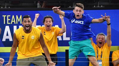 Australia's Nick Kyrgios and Alex de Minaur cheers Chris Guccione and John Peers during their doubles match against Canada at the ATP Cup in Brisbane. Reuters