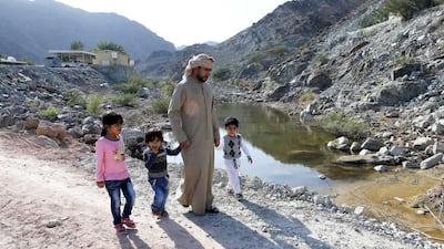 Residents worry that the ponds and puddles in front of their homes will obstruct emergency help if it were needed. Pawan Singh / The National