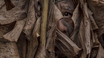 Devotees covered in mud and dried banana leaves take part in the Taong Putik ("mud people") Festival in the village of Bibiclat in Aliaga town, Nueva Ecija province, Philippines. Each year, the residents of Bibiclat village in Aliaga town celebrate the Feast of Saint John by covering themselves in mud, dried banana leaves, vines, and twigs as part of a little-known Catholic festival. Getty Images