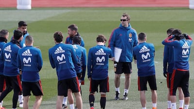 Julen Lopetegui, fourth from right, oversees a training session ahead of Spain's friendly match against Italy on Friday. Juan Carlos Hidalgo / EPA