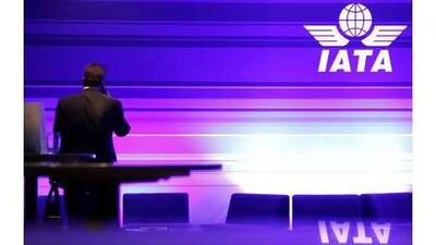 A delegate uses his mobile phone during a meeting of the International Air Transport Association in Berlin.