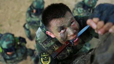 Paramilitary policemen take part in a summer training in Shenzhen, Guangdong province, China. China Daily via Reuters