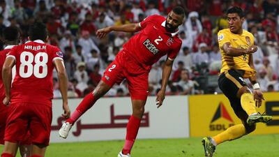 Paulinho, right, in action against Al Ahli in the first leg of the Asian Champions League final. Marwan Naamani / AFP
