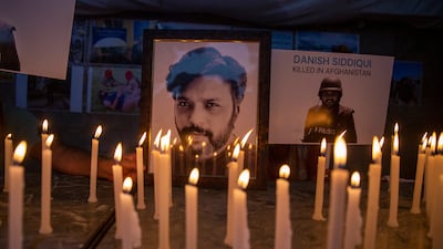 Journalists in New Delhi, India, light candles and pay tribute to Reuters photographer Danish Siddiqui, who was killed in Afghanistan covering clashes between the Taliban and Afghan security forces. AP