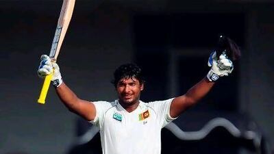 Kumar Sangakkara celebrates scoring his 30th Test century during the fourth day of the second Test match between Sri Lanka and Pakistan.