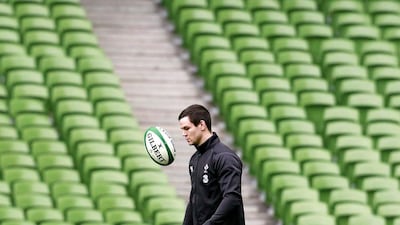 Ireland's Jonathan Sexton warms up during the Captain's Run at the Aviva Stadium in Dublin, February 13, 2015. Cathal McNaughton /Reuters