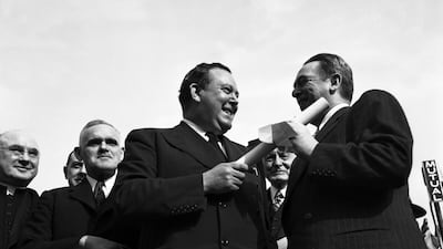 William O'Dwyer, right, Mayor of the City of New York, presenting to Trygve Lie, Secretary-General of the United Nations, the deed conveying to the United Nations all New York City property within the United Nations permanent headquarters site along the East River and Manhattan, during ceremony held on city playground located within site area. Seen at extreme left are Francis Cardinal Spellman, Archbishop of New York, and Colonel William Roy Hodgson, acting Australian representative on the United Nations Trusteeship Council. All Photos: UN Photo