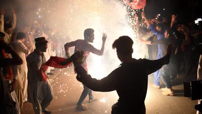 Supporters of Imran Khan celebrate in Karachi on July 26, a day after a general election. AFP
