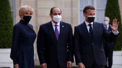 French President Emmanuel Macron and his wife Brigitte Macron welcomes Egyptian President Abdel Fattah el-Sissi, before a dinner at the Elysee Palace. EPA