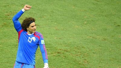 Mexico goalkeeper Guillermo Ochoa gestures after his team's Group A match against Brazil on Tuesday at the 2014 World Cup. Fabrice Coffrini / AFP / June 17, 2014