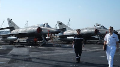 The carrier has a crew of 2,600, and is equipped with two nuclear reactors, producing the energy necessary to power four 16MW turbines and two catapults for launching planes. Delores Johnson / The National