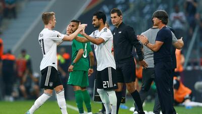 Ilkay Gundogan, centre, did not prove popular with Germany fans when he was brought on by manager Joachim Low, right, during Friday's 2-1 friendly win over Saudi Arabia. Thilo Schmuelgen / Reuters
