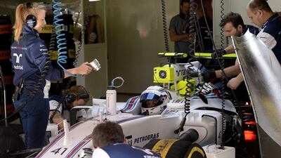 Susie Wolff sits in the pits during the first practice session at the Circuit de Catalunya on May 8, 2015. Tom Gandolfini / AFP