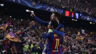 Barcelona's Lionel Messi celebrates with Neymar after their victory during the Champion League round of 16 against Paris Saint Germain at the Camp Nou stadium in Barcelona, Spain, on March 8, 2017. Emilio Morenatti / AP