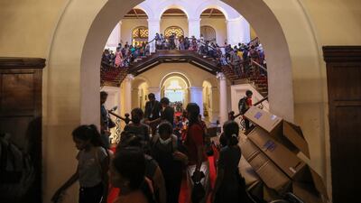 Crowds flock to take in the presidential palace. EPA