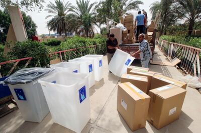 Iraqi Independent High Electoral Commission staff members distribute ballot boxes and polling materials to polling stations in Basra. Essam Al Sudani / Reuters