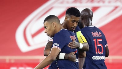 Kylian Mbappe (L) celebrates with defender Presnel Kimpembe after scoring a penalty . AFP