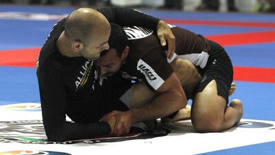 Mohammed Al Qubaisi (UAE, + 76 kg) on his way to victory against the tough Jose Ribamar Junior (Brazil, + 76 kg) during their weight division Jiu Jitsu match. Jeffrey E Biteng / The National