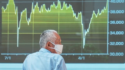 An electronic board shows Japan's Nikkei index at a securities firm in Tokyo. AP