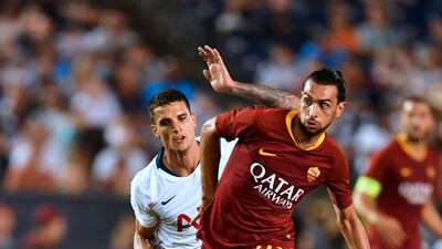 Roma's Javier Pastore vies for the ball with Tottenham's Erik Lamela. AFP