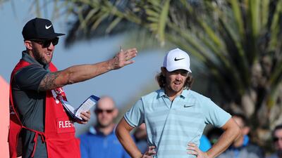 Tommy Fleetwood and his caddie.