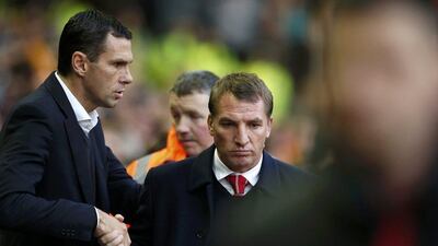 Sunderland manager Gus Poyet, left, greets Liverpool manager Brendan Rodgers on Saturday before their Premier League match. Phil Noble / Reuters