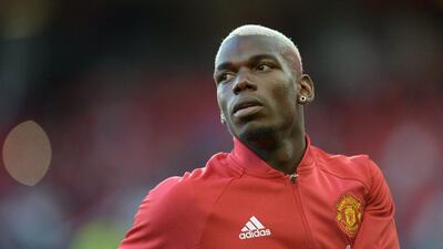 Manchester United’s Paul Pogba warms up ahead of the Premier League football match between Manchester United and Southampton at Old Trafford in Manchester, north west England, on August 19, 2016. Oli Scarff / AFP