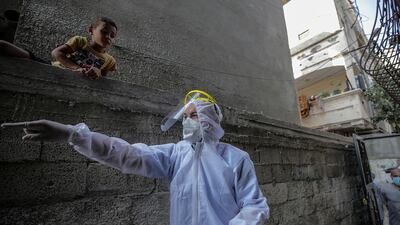 A Palestinian medic prepares to take swab sample in the city of Beit Hanun Northern Gaza Strip. EPA