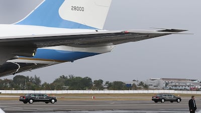 Barack Obama and his family cavalcade pass Air Force One at Jose Marti International Airport while on a 48-hour visit to Havana, Cuba, on March 20, 2016.