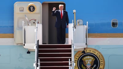 US President Donald Trump disembarks from his Air Force One flight on arrival at Kuala Lumpur International Airport to attend the 47th Association of Southeast Asian Nations (Asean) summit in the Malaysian capital. AP
