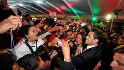 Presidential candidate Enrique Pena Nieto of the Institutional Revolutionary Party (PRI) celebrates with supporters.