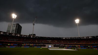 The sky goes dark due to a thunderstorm that stopped play on Day 2 of the fourth Test match at the Gabba in Brisbane, on Saturday, January 16. Reuters