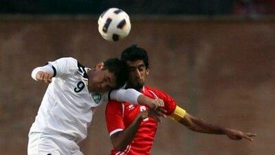Hamdan Al Kamali, right, on loan from Al Wahda to French club Lyon, has inspired his UAE teammates to perform on the big stage. The captain called their win over Uzbekistan the best in his career. Sammy Dallal / The National