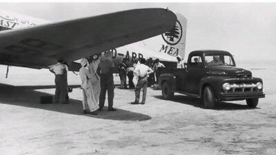 Caption Cargo is unloaded from an MEA (Middle East Airlines) aircraft onto a Ford vehicle in Qatar, September 1953. (Photo by Keystone Features/Hulton Archive/Getty Images)